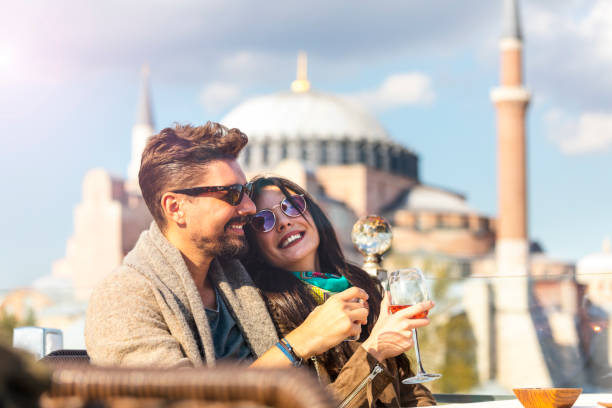 tourist couple drinking whisket and wine in sultanahmet